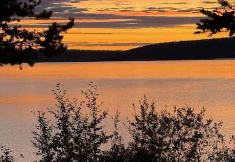 Orange sunrise over a lake