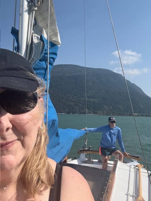 man and woman on sailboat